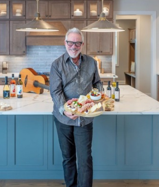 Paul Cullen welcoming guests from his kitchen